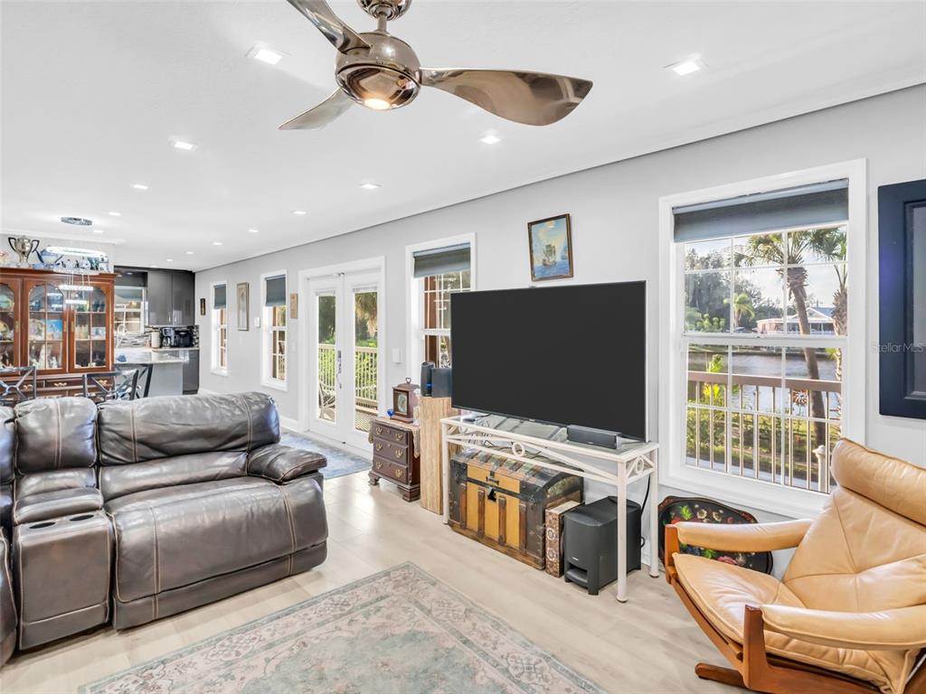 4915 S Road New Port Richey, FL 34652 - Photo 17 of 93 a living room with furniture and a flat screen tv