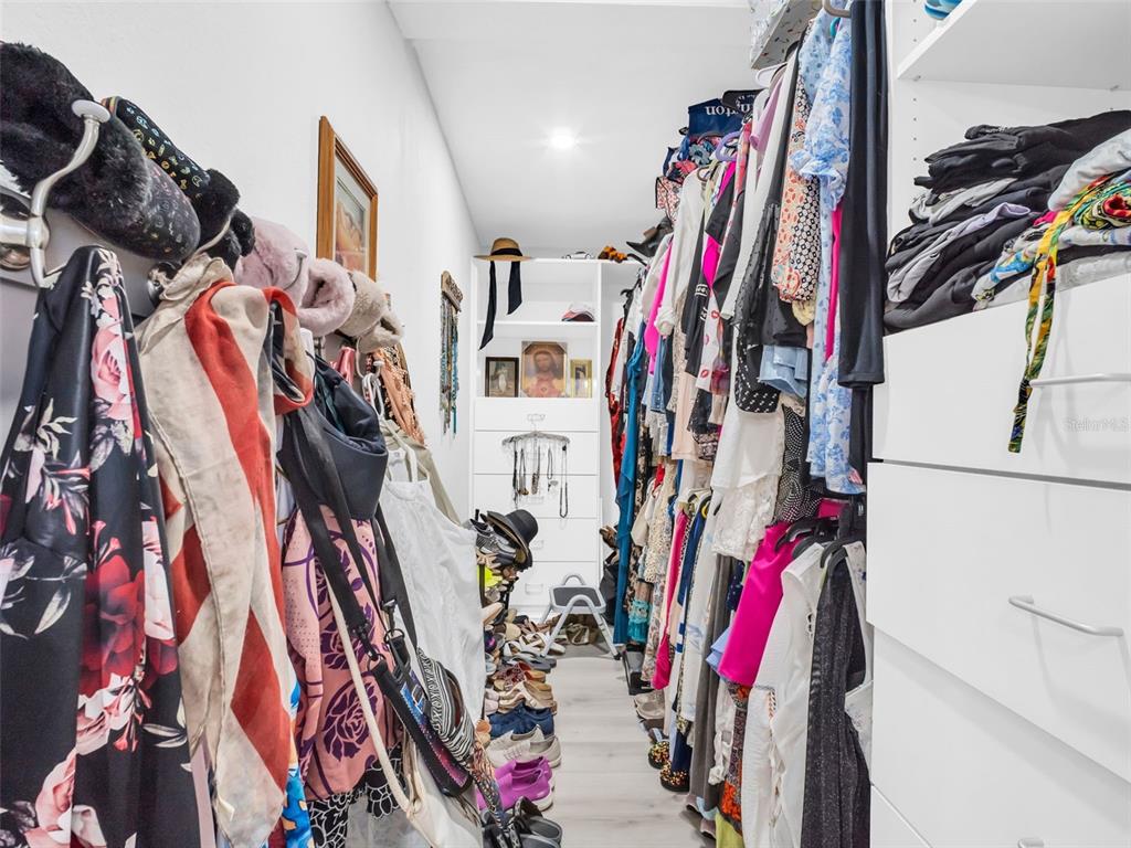 4915 S Road New Port Richey, FL 34652 - Photo 25 of 93 a view of walk in closet with clothes