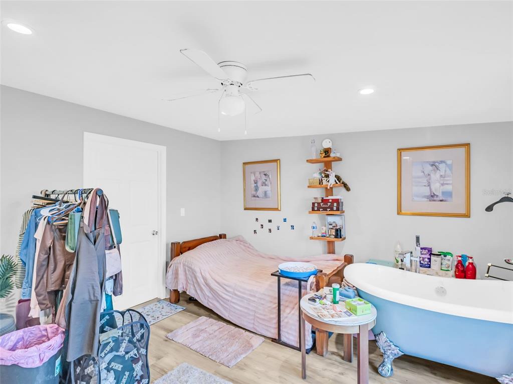 4915 S Road New Port Richey, FL 34652 - Photo 31 of 93 a bedroom with a bed and a desk