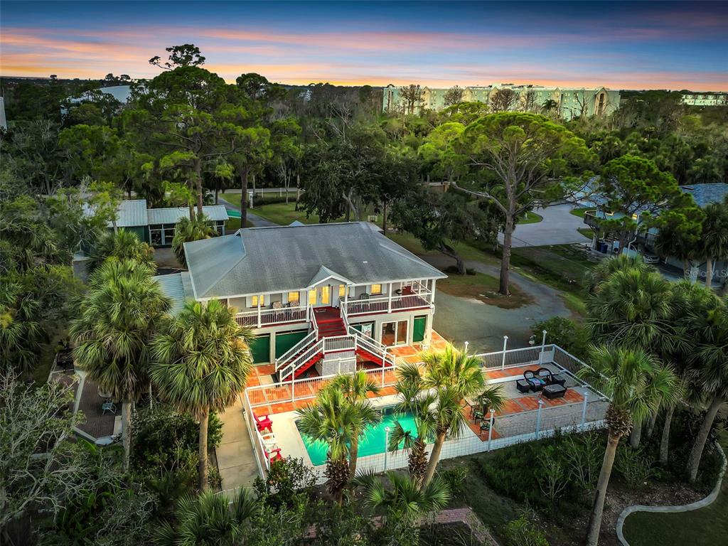 4915 S Road New Port Richey, FL 34652 - Photo 4 of 93 an aerial view of a house with yard swimming pool and outdoor seating