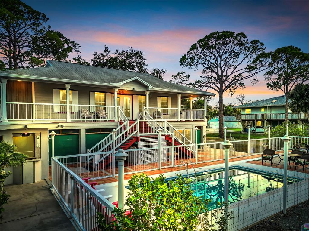 4915 S Road New Port Richey, FL 34652 - Photo 49 of 93 front view of a house with a swimming pool