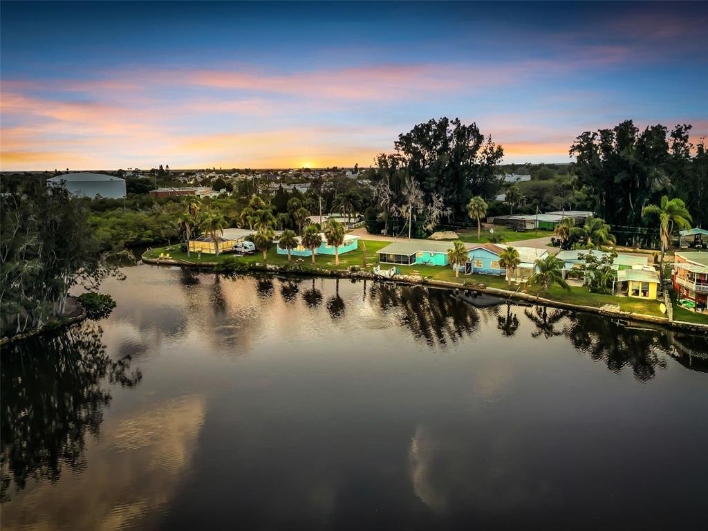 4915 S Road New Port Richey, FL 34652 - Photo 56 of 93 a view of a lake with a nearby beach