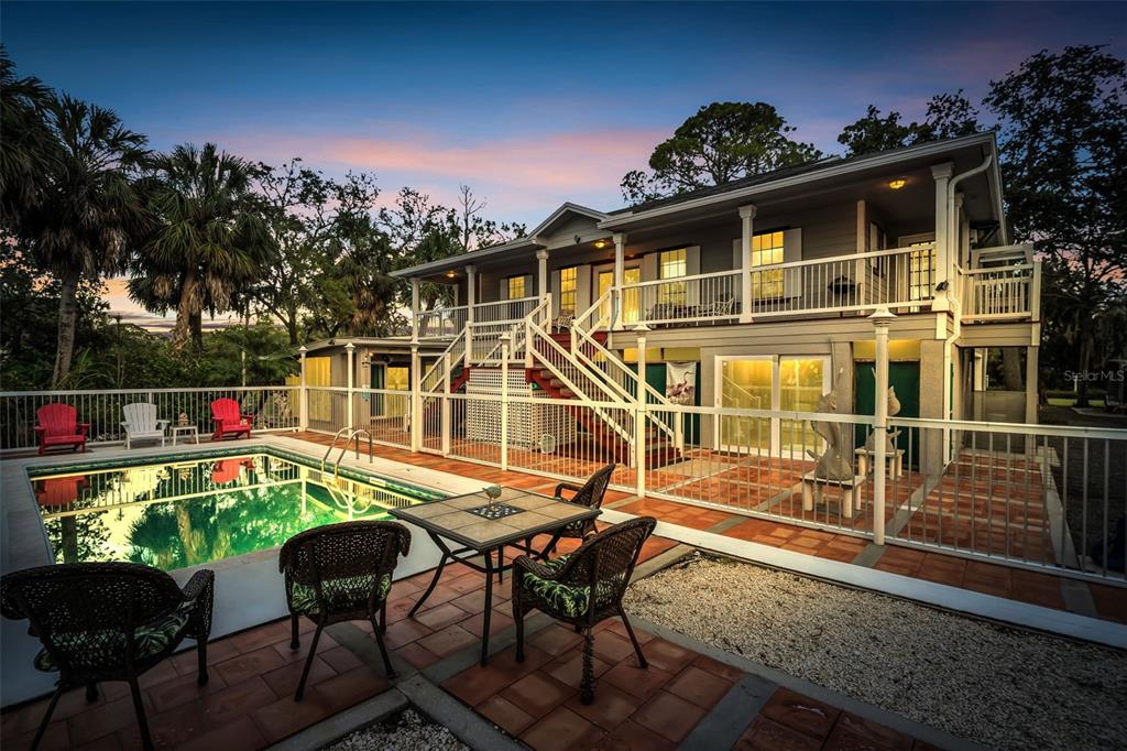 4915 S Road New Port Richey, FL 34652 - Photo 73 of 93 a view of a chairs and table on the terrace