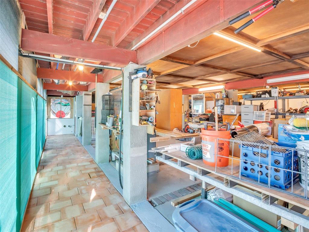 4915 S Road New Port Richey, FL 34652 - Photo 89 of 93 a view of a storage room with wooden floor