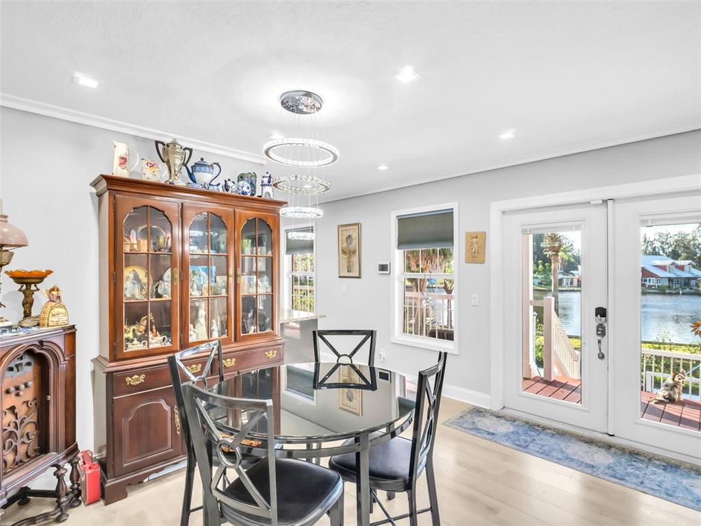 4915 S Road New Port Richey, FL 34652 - Photo 9 of 93 a view of a dining room with furniture window and outside view