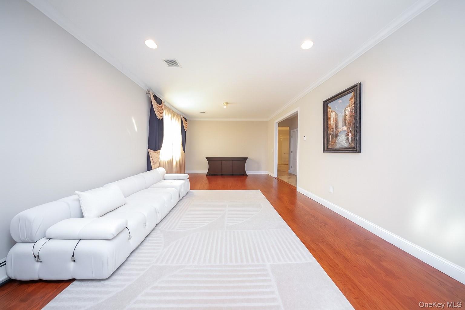 104 Highland Road Staten Island, NY 10308 - Photo 14 of 46 Living area featuring wood finished floors, recessed lighting, and crown molding