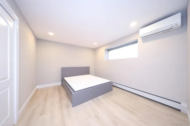 a room with a bed and a window