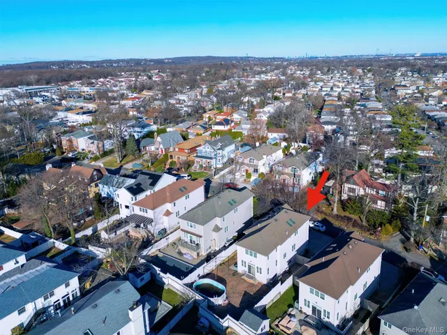 an aerial view of a house with a ocean view