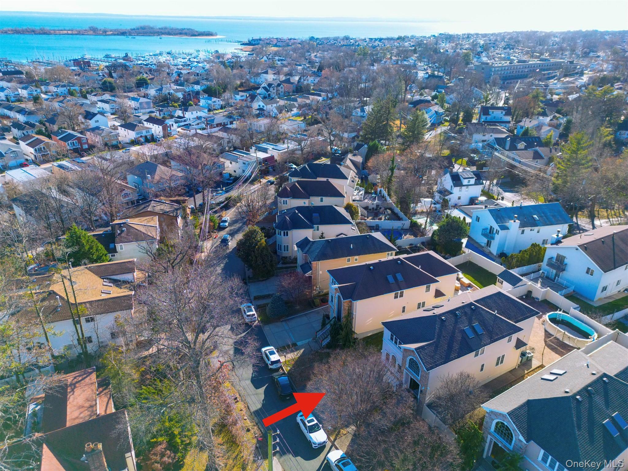 104 Highland Road Staten Island, NY 10308 - Photo 27 of 46 Aerial view of property's location with nearby suburban area and a large body of water