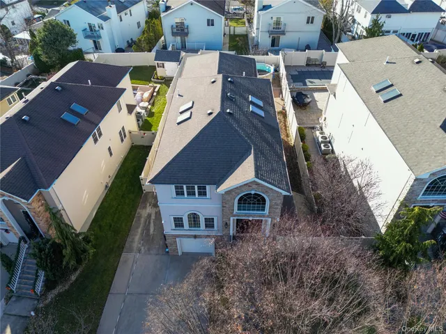 an aerial view of a house with outdoor space