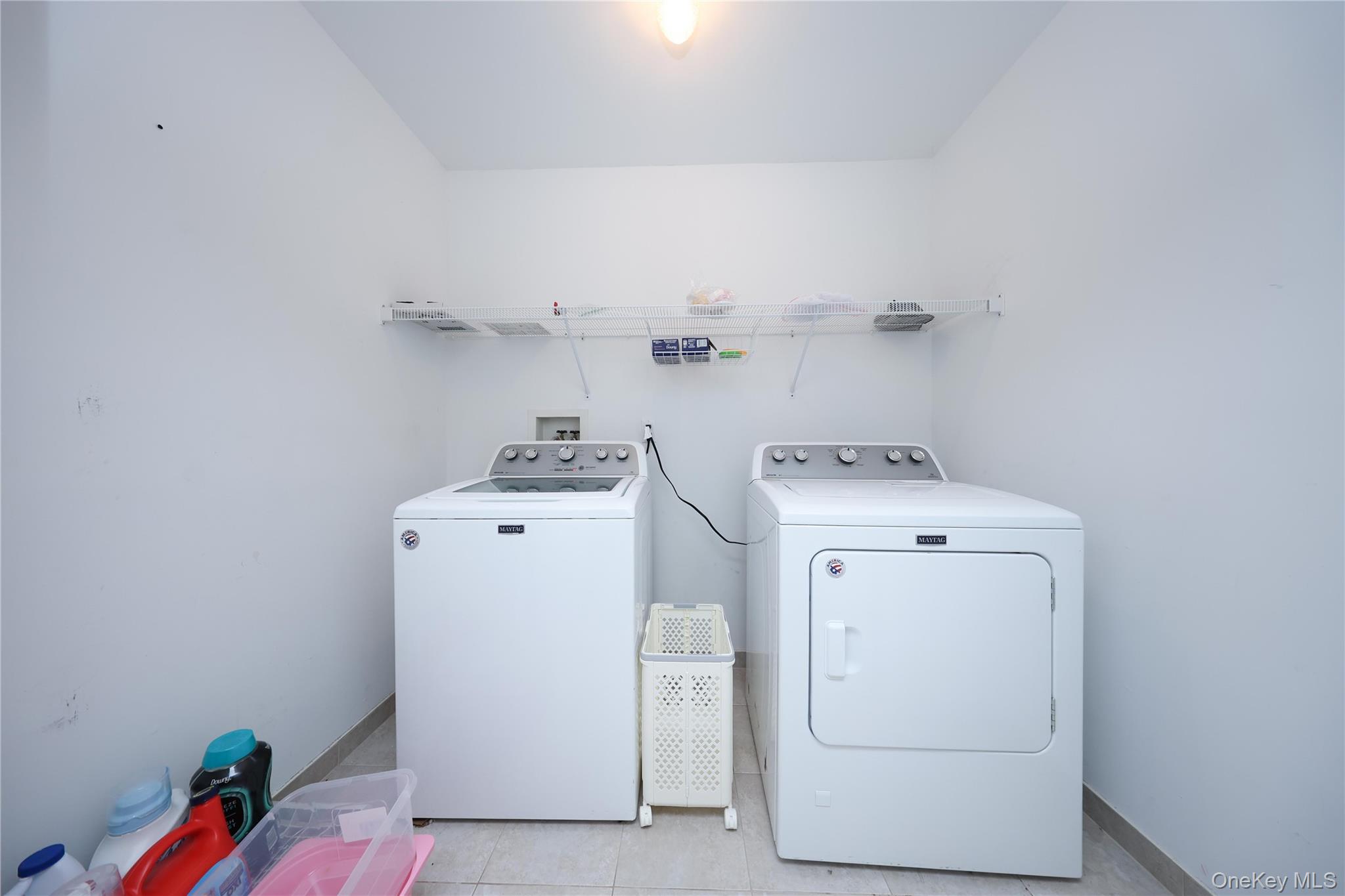104 Highland Road Staten Island, NY 10308 - Photo 35 of 46 Laundry room featuring light tile patterned floors and washing machine and dryer