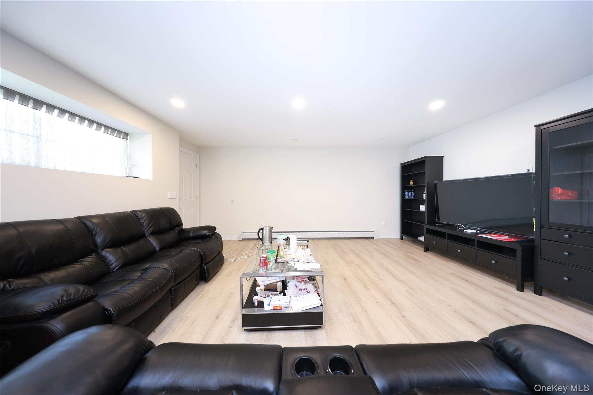 104 Highland Road Staten Island, NY 10308 - Photo 39 of 46 Living area with light wood-type flooring and recessed lighting