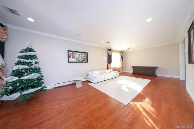 a bedroom with a bed and a potted plant