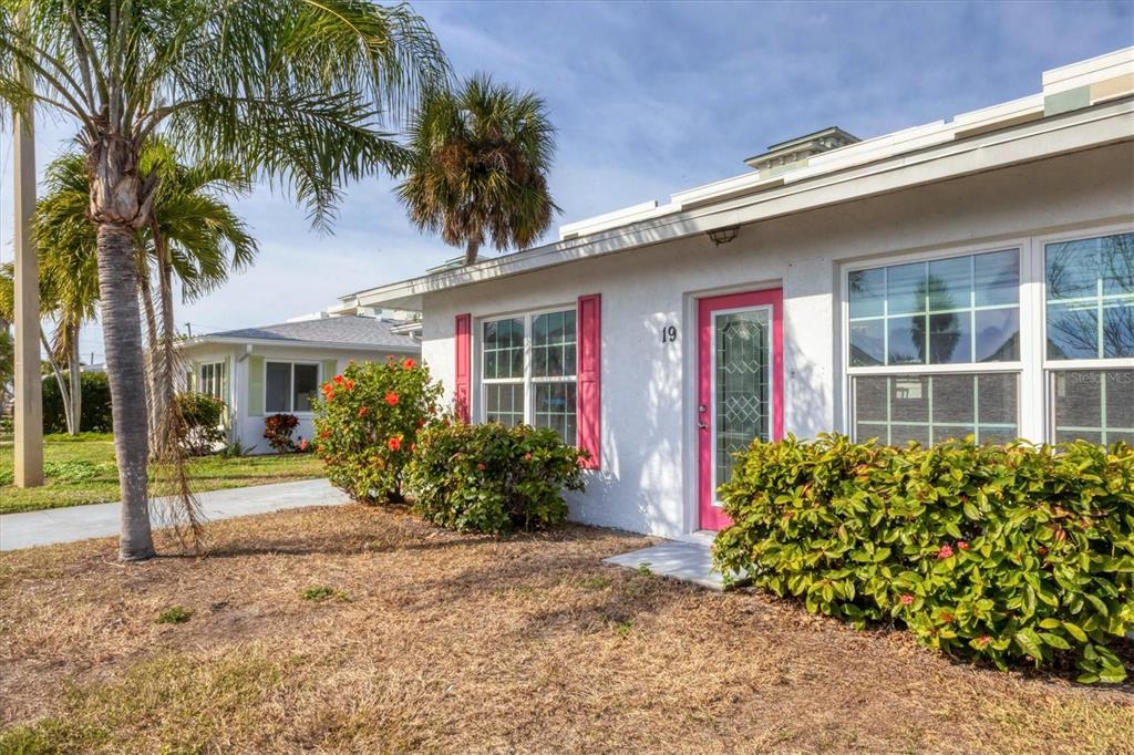 1977 Beach Road, Unit 19 Englewood, FL 34223 - Photo 2 of 47 front view of a house with a yard