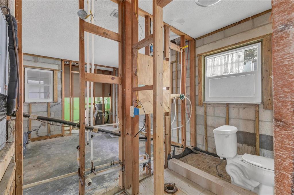 1977 Beach Road, Unit 19 Englewood, FL 34223 - Photo 22 of 47 a bathroom with a shower