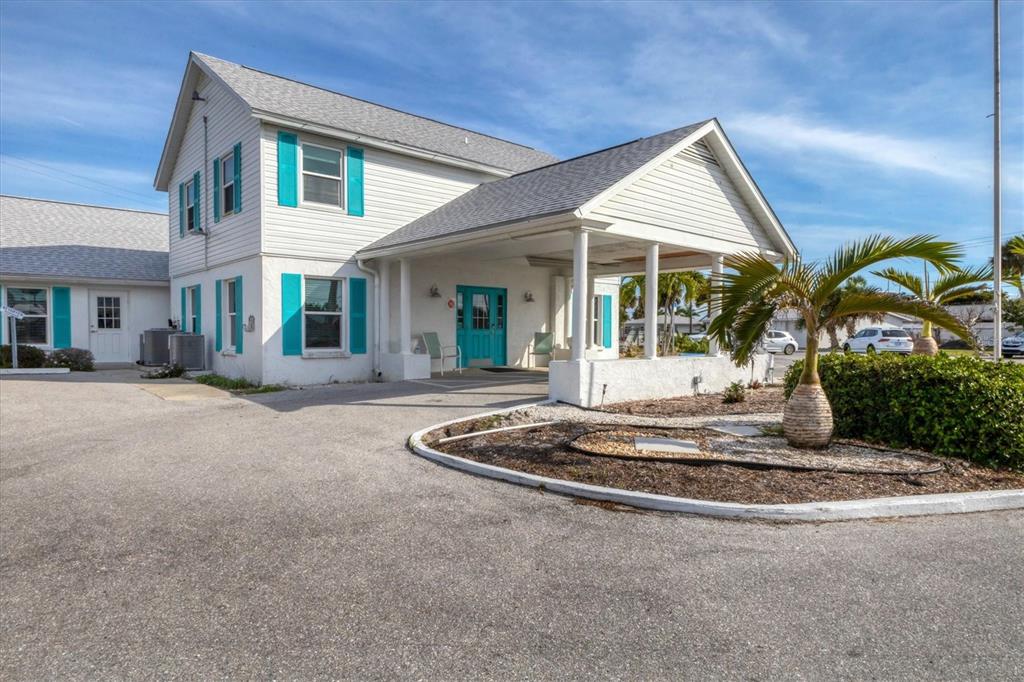1977 Beach Road, Unit 19 Englewood, FL 34223 - Photo 30 of 47 a front view of a house with entertaining space