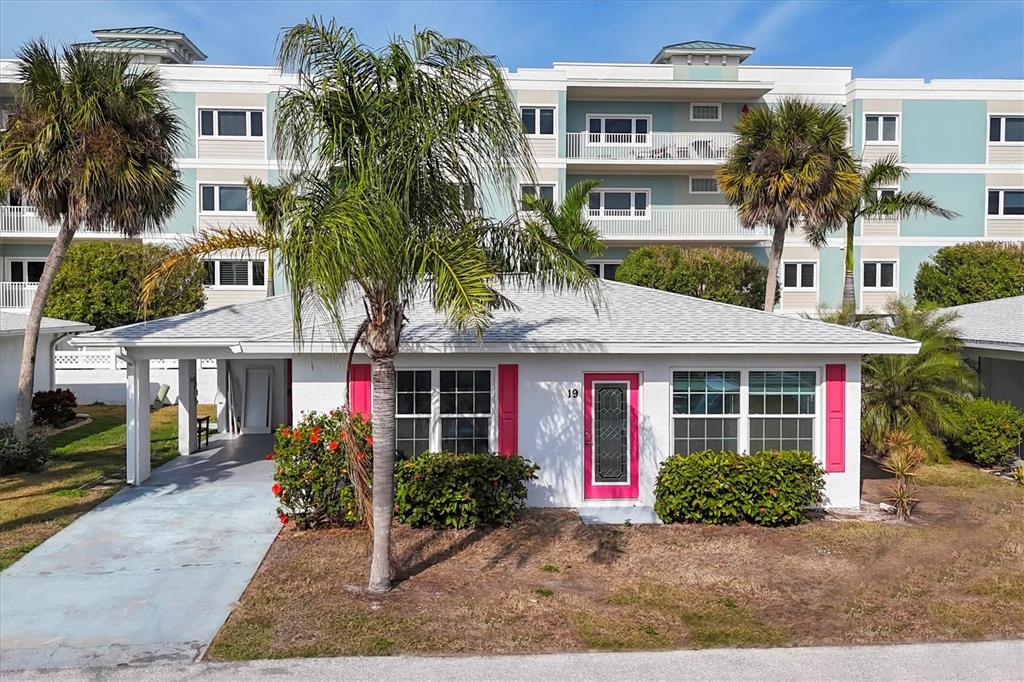 1977 Beach Road, Unit 19 Englewood, FL 34223 - Photo 3 of 47 a front view of a house with garden