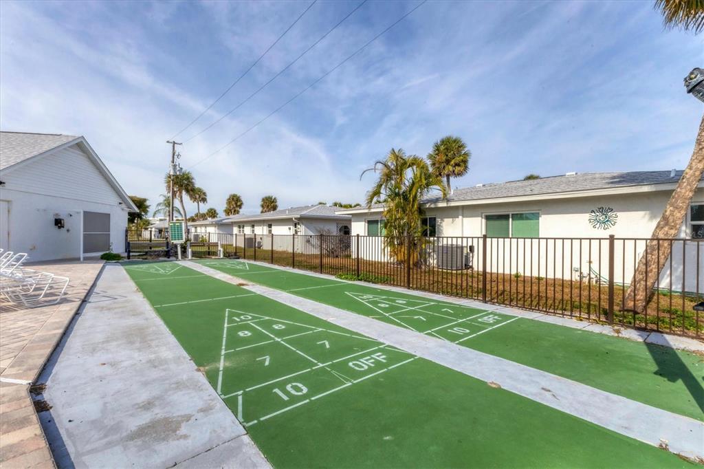 1977 Beach Road, Unit 19 Englewood, FL 34223 - Photo 33 of 47 a view of a house with a yard