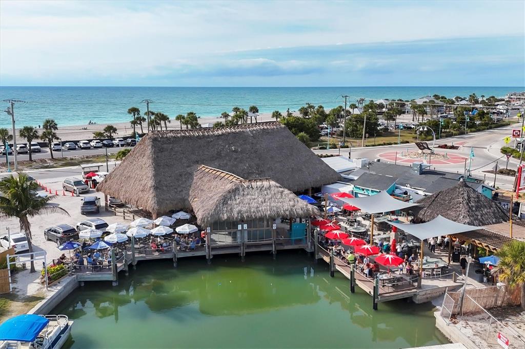1977 Beach Road, Unit 19 Englewood, FL 34223 - Photo 42 of 47 a city view with boat and palm trees