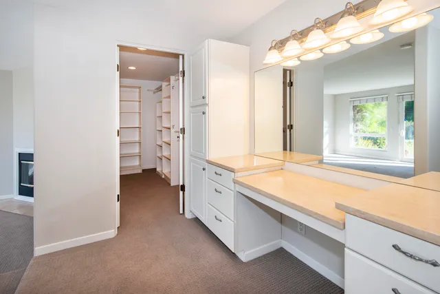 a view of a big room with windows and yard