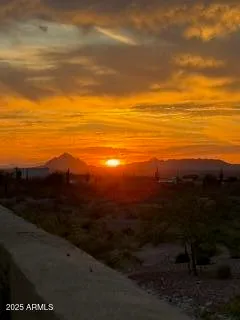 a view of an ocean and mountain