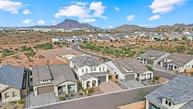 an aerial view of residential houses with outdoor space