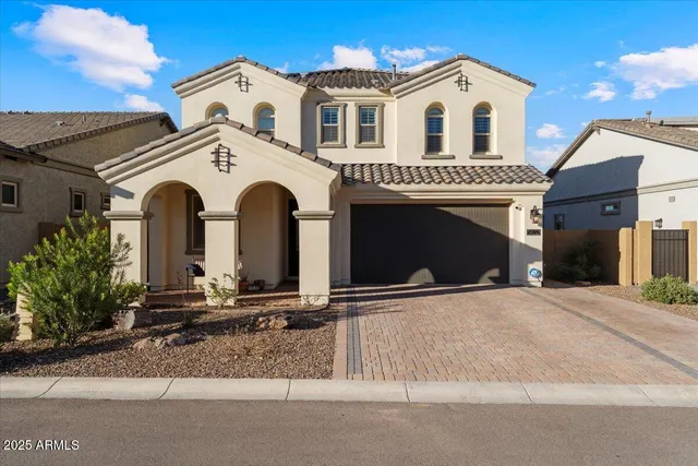 a view of a white house with a outdoor space