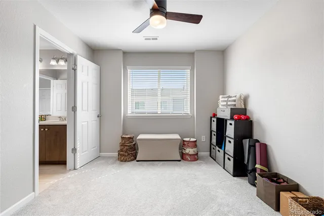 an empty room with closet and mirrors