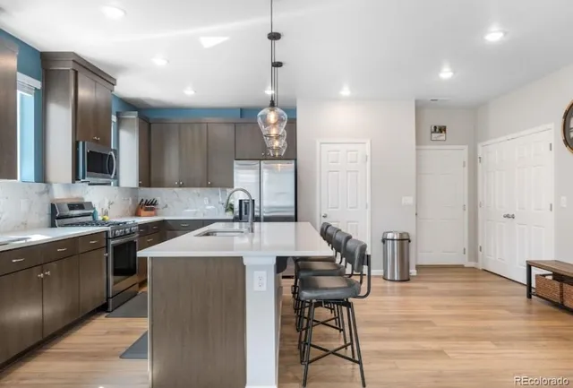 a kitchen with a center island and appliances