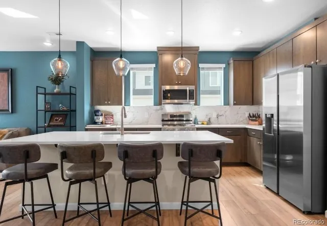 a kitchen with a stove and a microwave