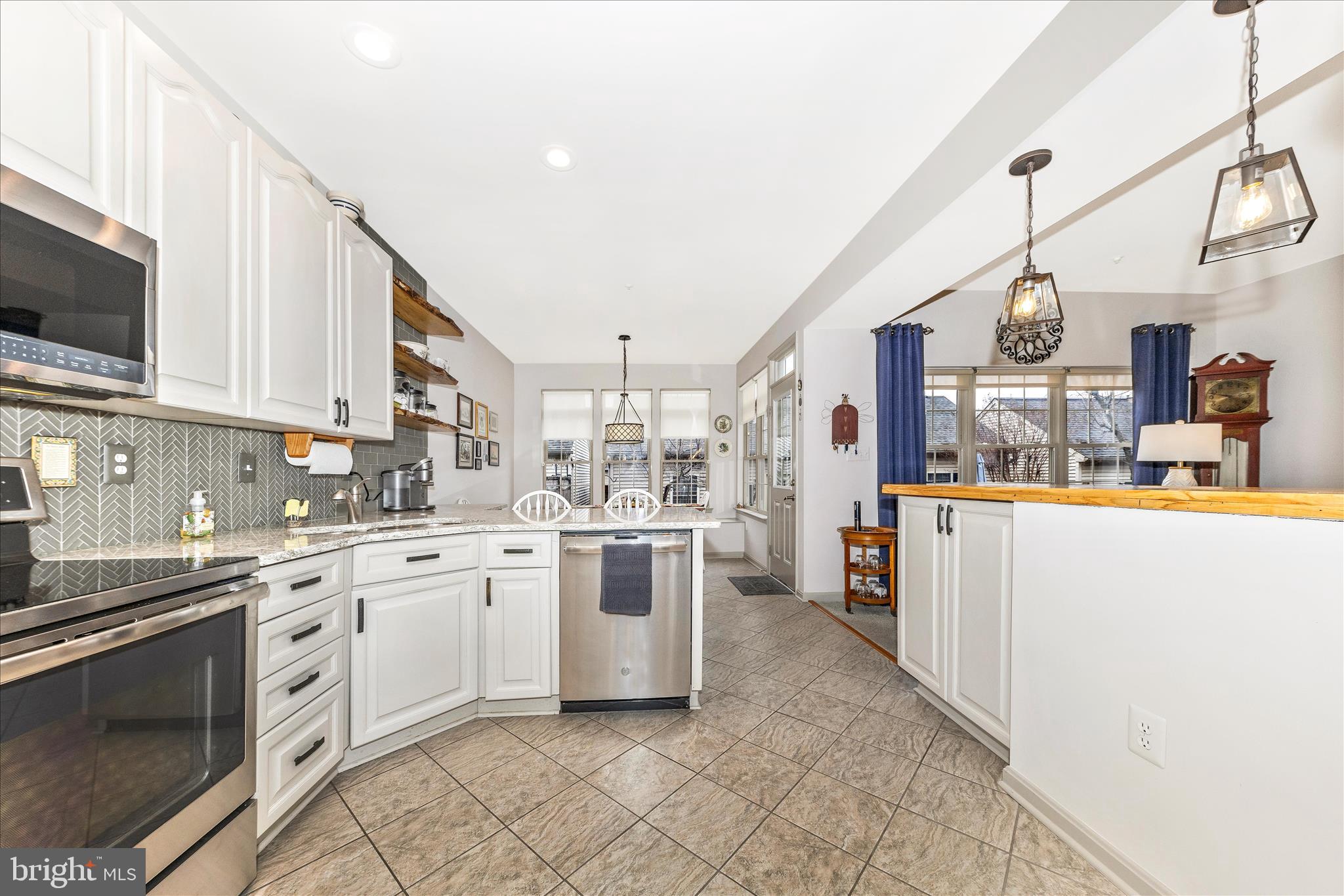 2205 Garden Lane Frederick, MD 21701 - Photo 11 of 48 a kitchen with a sink and white cabinets