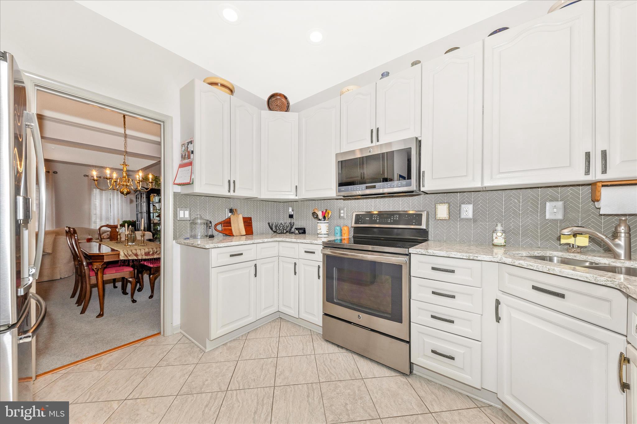 2205 Garden Lane Frederick, MD 21701 - Photo 13 of 48 a kitchen with cabinets appliances and a window