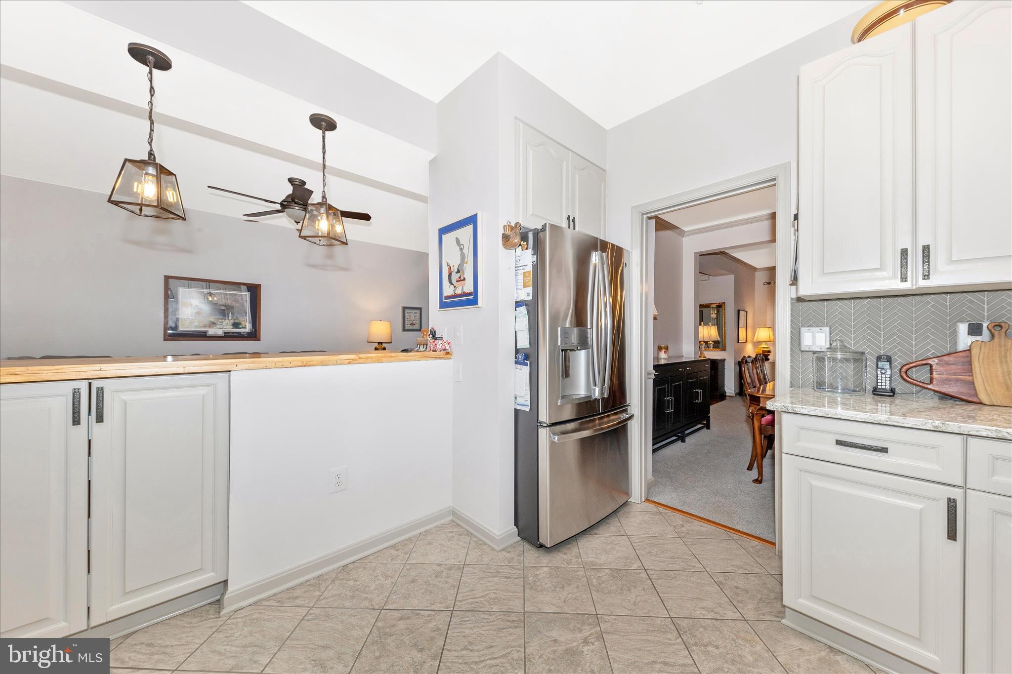 2205 Garden Lane Frederick, MD 21701 - Photo 14 of 48 a kitchen with refrigerator and cabinets
