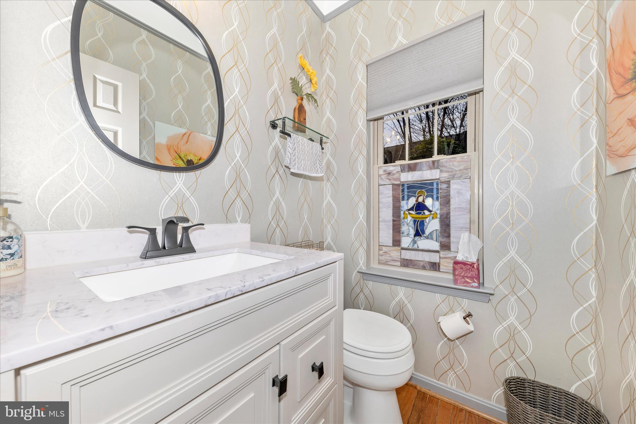 2205 Garden Lane Frederick, MD 21701 - Photo 17 of 48 a bathroom with a sink a toilet and a mirror