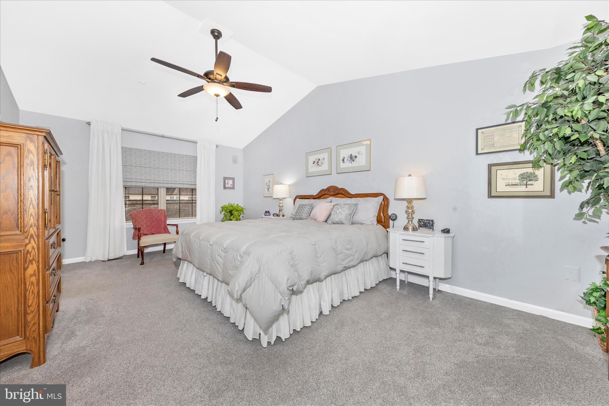 2205 Garden Lane Frederick, MD 21701 - Photo 18 of 48 a bedroom with a bed and a chandelier