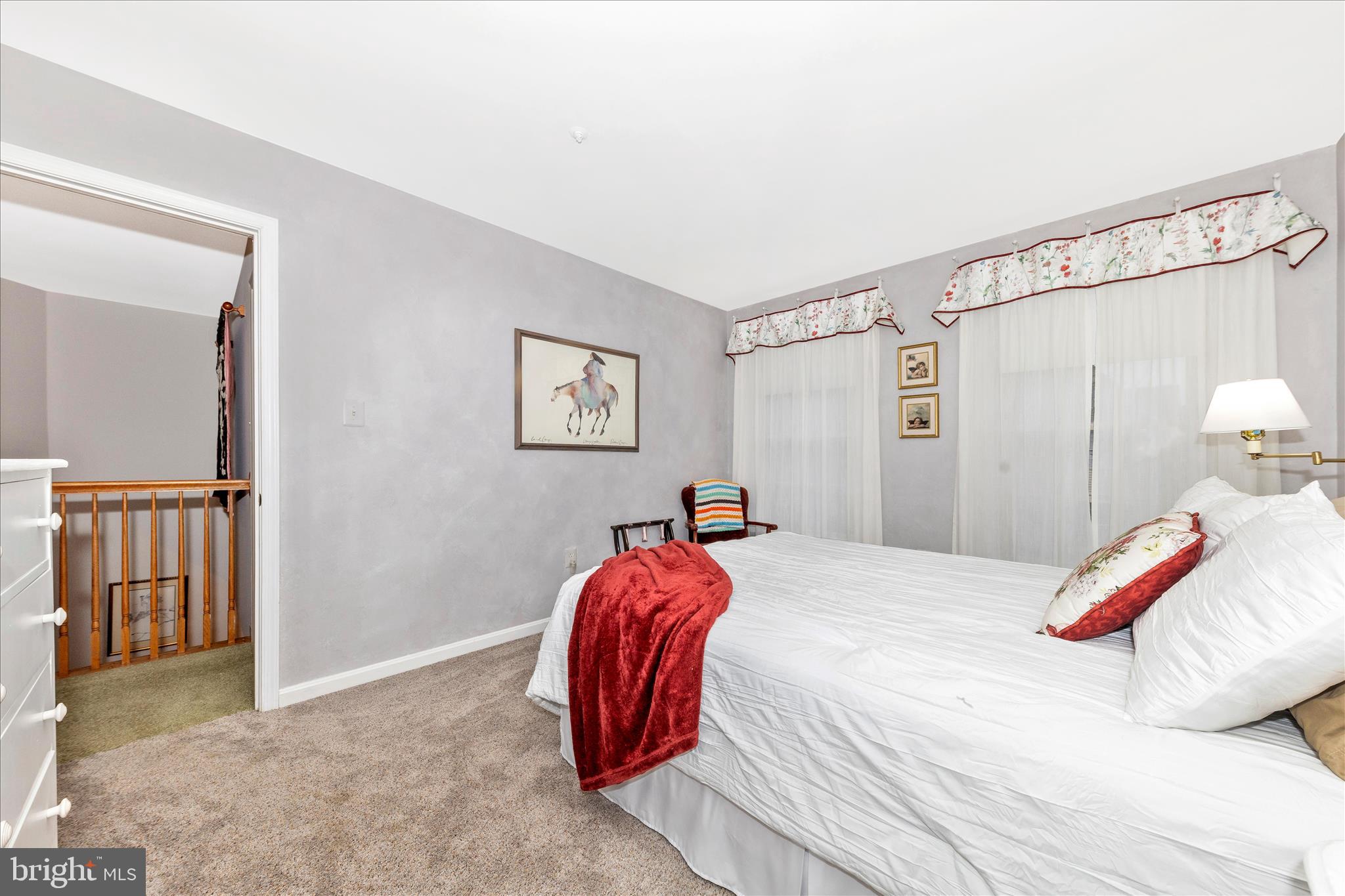 2205 Garden Lane Frederick, MD 21701 - Photo 25 of 48 a bedroom with a bed and a painting on the wall