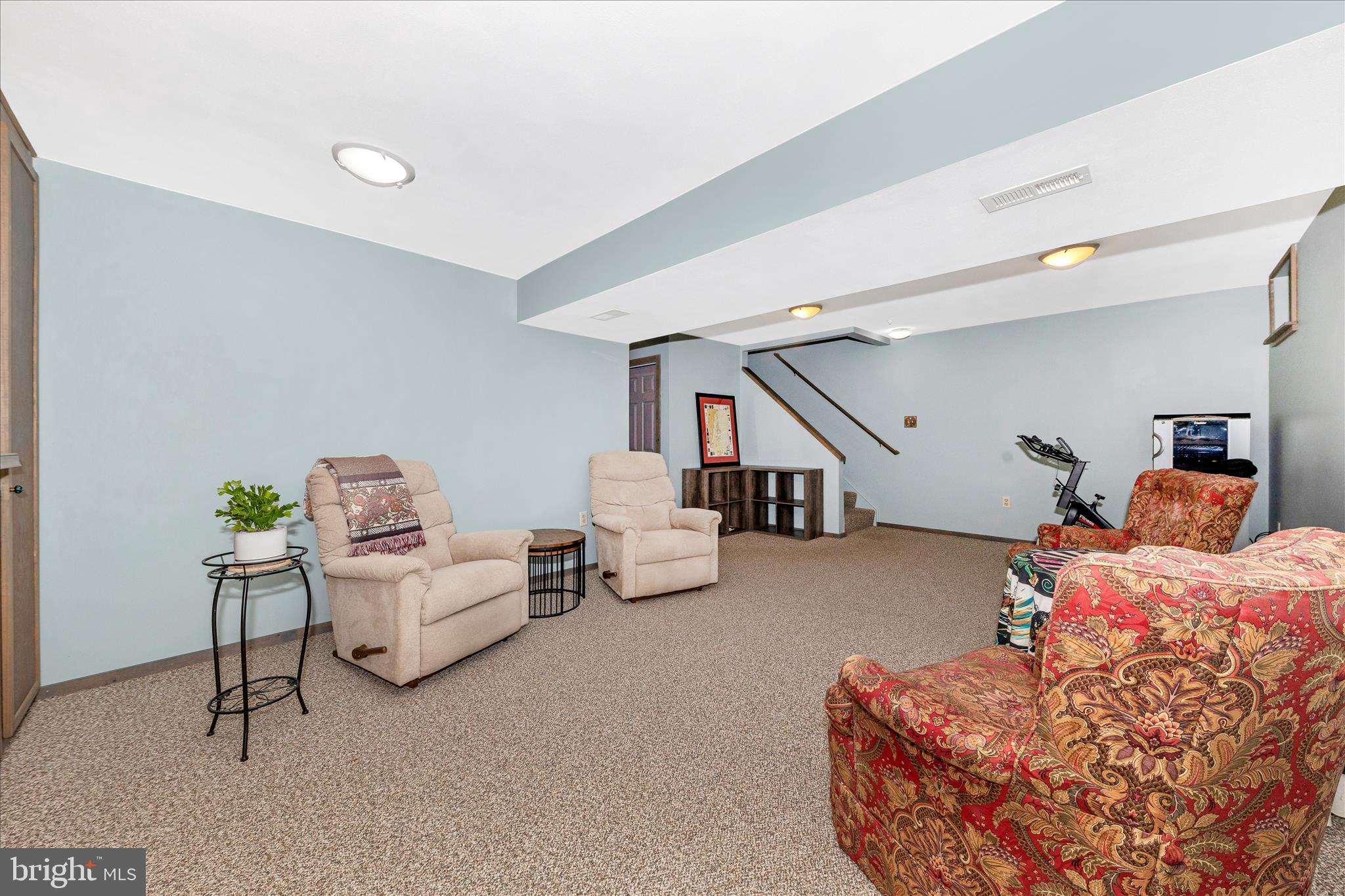 2205 Garden Lane Frederick, MD 21701 - Photo 32 of 48 a bedroom with furniture and a chair