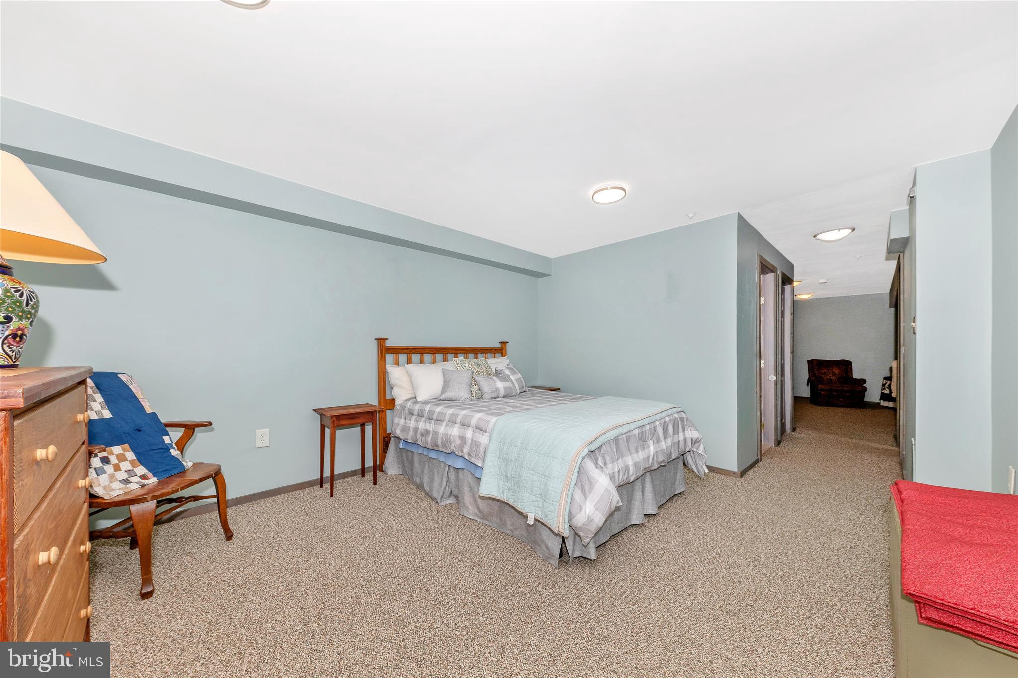 2205 Garden Lane Frederick, MD 21701 - Photo 34 of 48 a bedroom with a bed and a chair