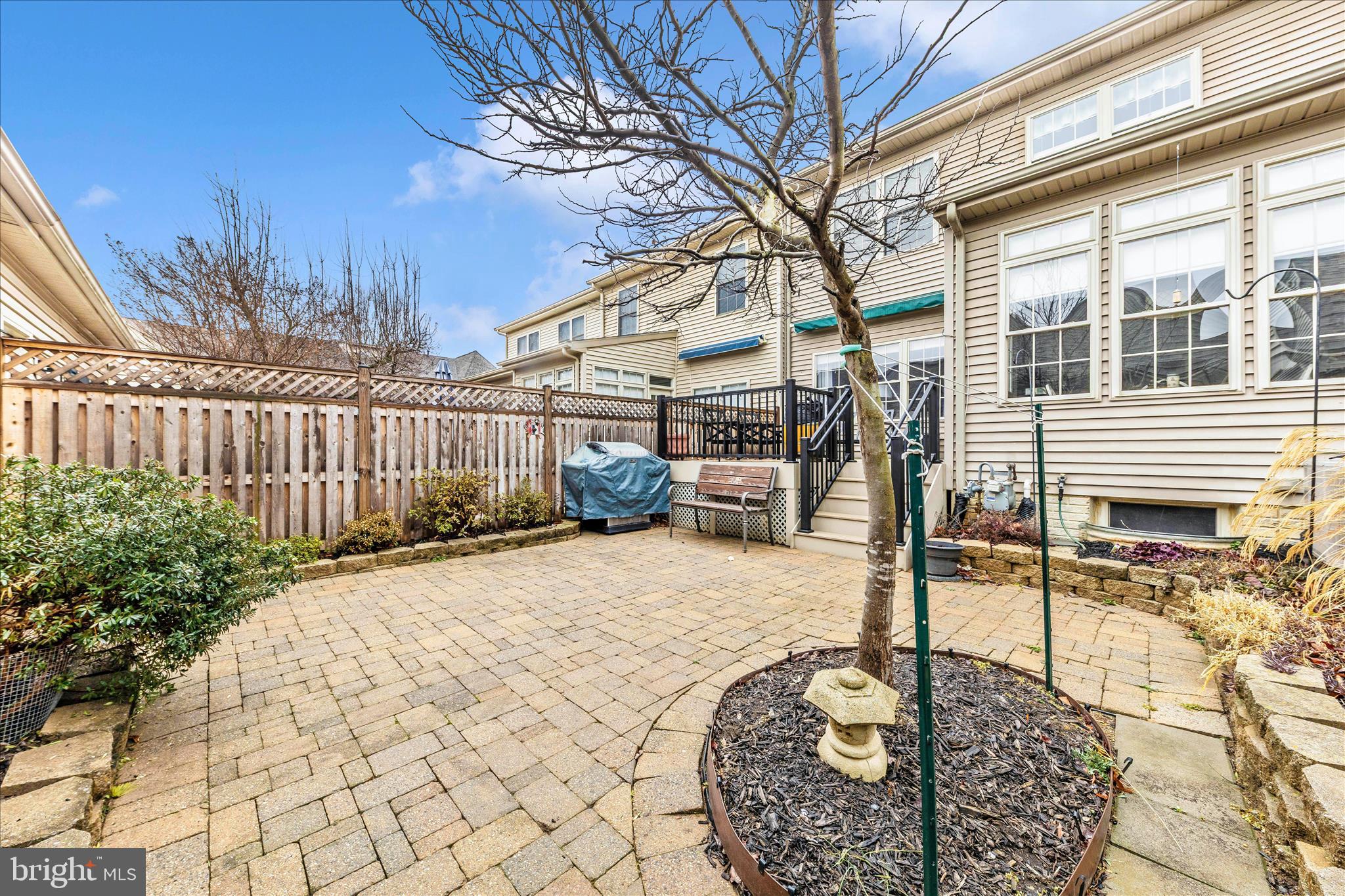 2205 Garden Lane Frederick, MD 21701 - Photo 44 of 48 a backyard of a house with basket ball table and chairs