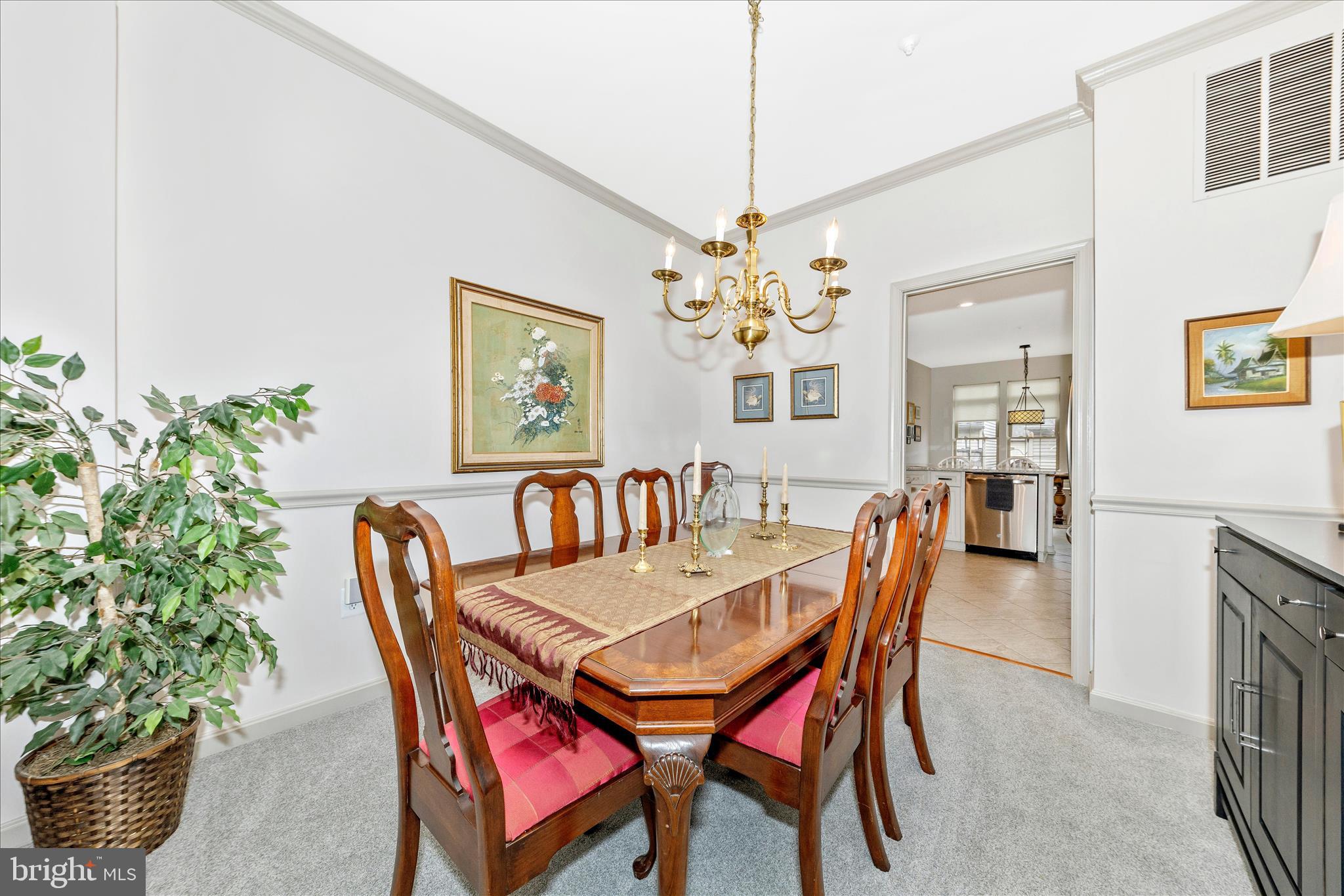 2205 Garden Lane Frederick, MD 21701 - Photo 7 of 48 a dining room with furniture a chandelier and wooden floor