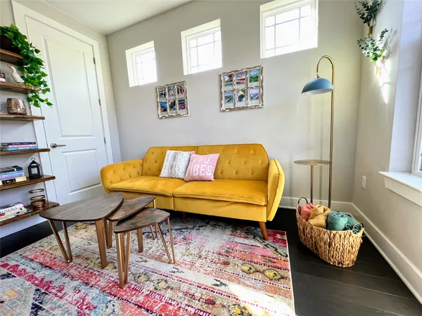a living room with a couch and a table
