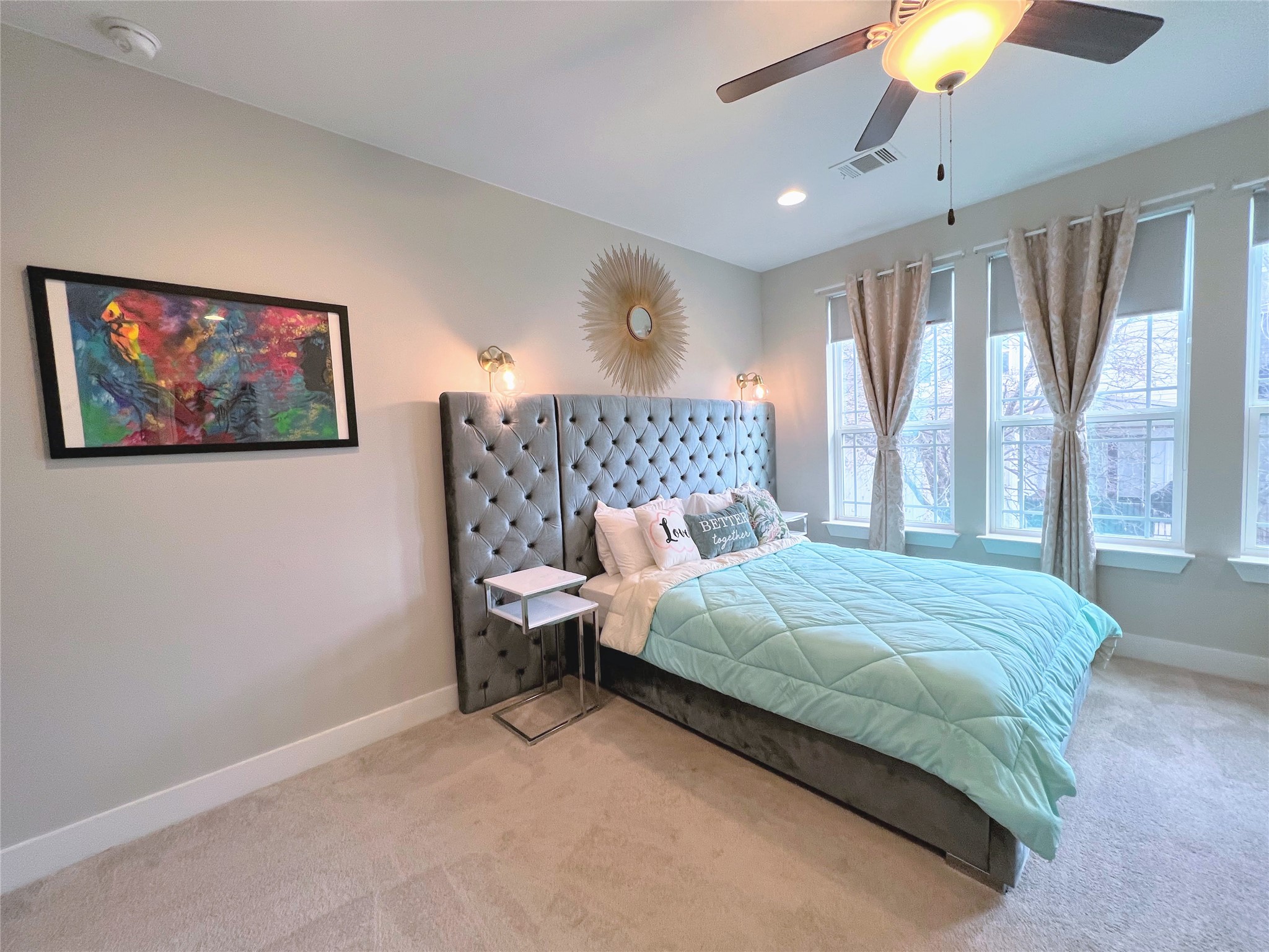 807 East 16th Street, Unit B Austin, TX 78702 - Photo 15 of 25 a bedroom with a bed and a chandelier