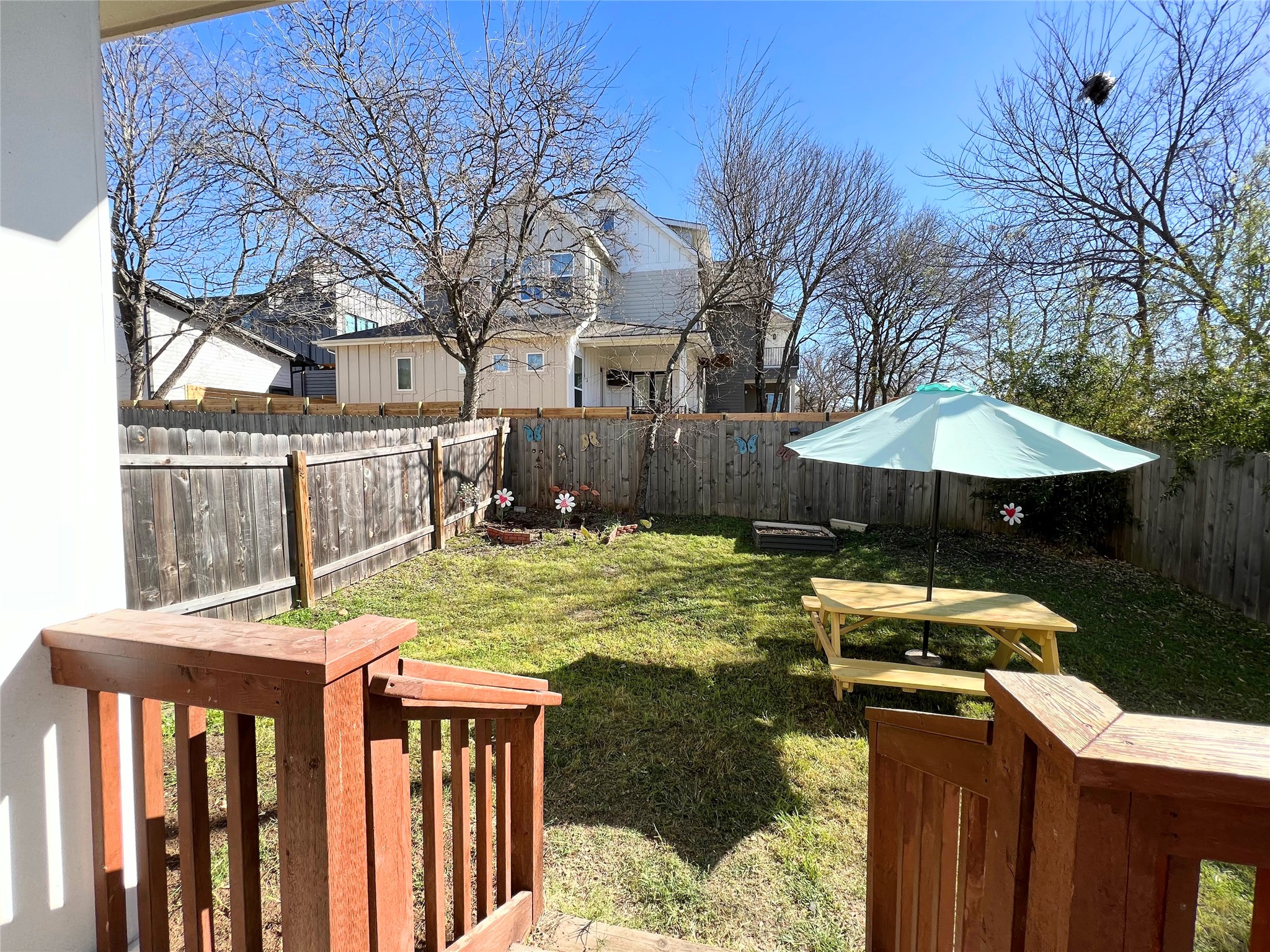 807 East 16th Street, Unit B Austin, TX 78702 - Photo 24 of 25 a backyard of a house with barbeque oven table and chairs