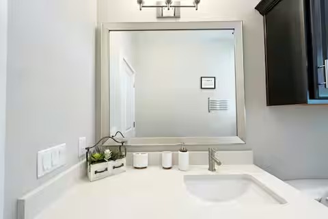 807 East 16th Street, Unit B Austin, TX 78702 - Photo 25 of 31 a bathroom with a sink and a mirror