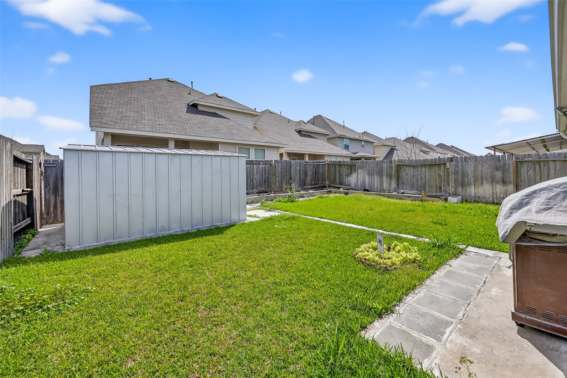 7631 Granite Terrace Lane Houston, TX 77083 - Photo 39 of 46 a view of a backyard with a garden and plants