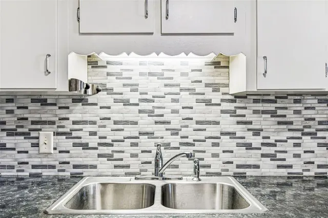 a view of a swimming pool and lounge chair