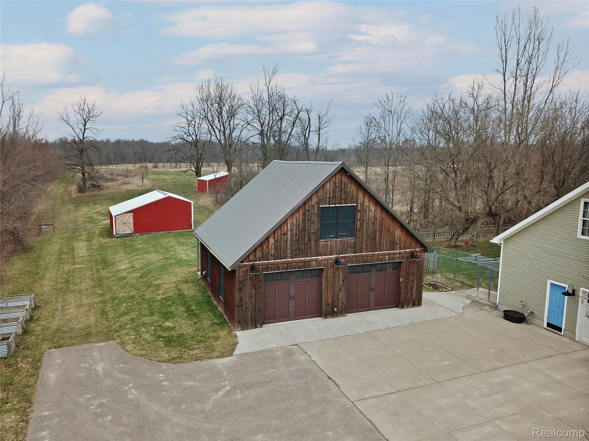 3690 Brauer Road Oxford, MI 48371 - Photo 51 of 63 View of outbuilding featuring driveway