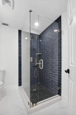 a bathroom with a double vanity sink and mirror
