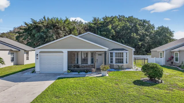 an aerial view of a house with a lake view