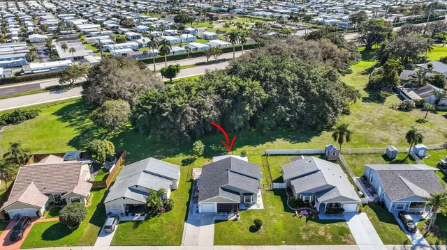 an aerial view of residential houses with outdoor space